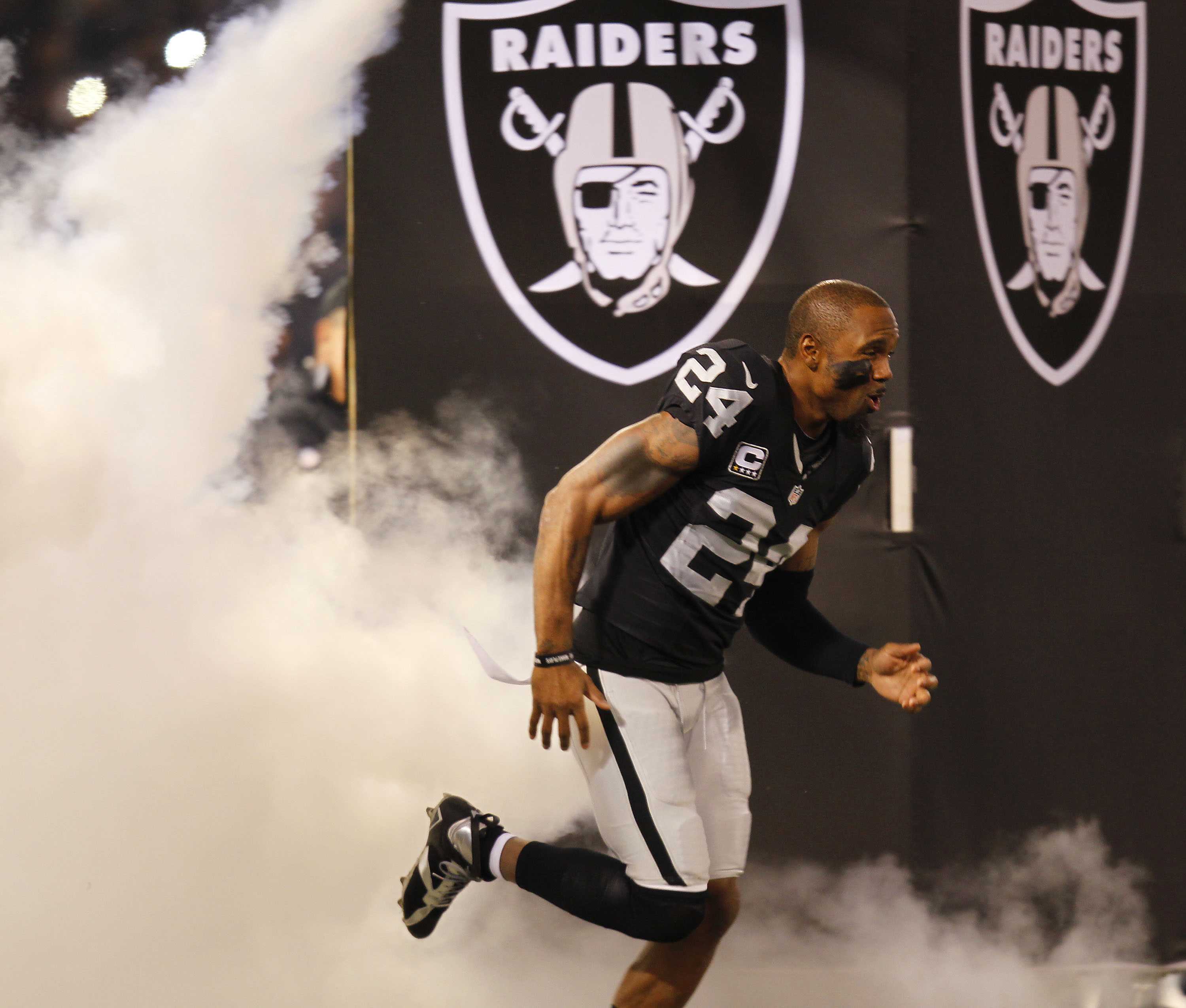 Charles Woodson celebrates an interception and a brief moment of