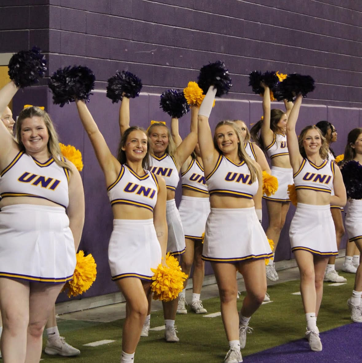 The UNI Cheer Squad can be seen on the sidelines of UNI athletic events, cheering for the Panthers.